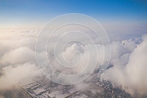 Aerial view of modern combined heat and power plant. Fuming chimney. Heavy industry from above. Power and fuel generation in