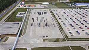 Aerial view of modern factory. Industrial territory and many cars nearby from above. Industrial concept