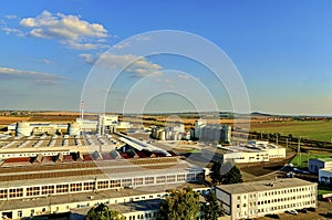 Aerial view of modern factory. Modern plant with blue sky.