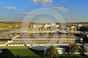 Aerial view of modern factory. Modern plant with blue sky.