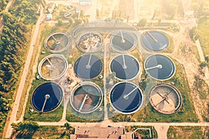 Aerial view of modern industrial sewage treatment plant at sunset