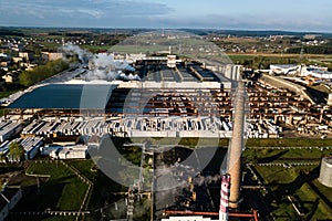 Aerial view of modern large industrial factory with smokestack,