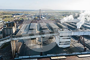 Aerial view of modern large industrial factory with smokestack,