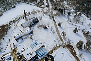 Aerial view of modern little industrial sewage treatment plant at work in winter season