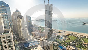 Aerial view of modern skyscrapers and beach at Jumeirah Beach Residence JBR timelapse in Dubai, UAE