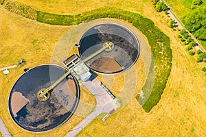 Aerial view of modern water cleaning facility at urban wastewater treatment plant. Purification process of removing undesirable