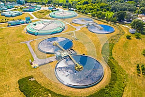 Aerial view of modern water cleaning facility at urban wastewater treatment plant. Purification process of removing undesirable