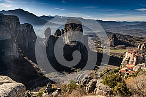 Aerial view of monastery Rousanou and breathtaking picturesque valley and landmark canyon of Meteora at sunset, Kalambaka, Greece