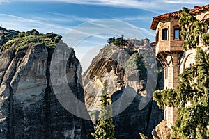 Aerial view of monastery Rousanou and breathtaking picturesque valley and landmark canyon of Meteora at sunset, Kalambaka, Greece