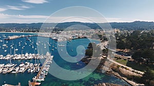 Aerial view of the Monterey Bay Aquarium, Pacific Grove with many yachts docked