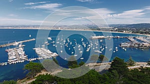 Aerial view of the Monterey Bay Aquarium, Pacific Grove with many yachts docked