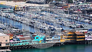 Aerial view of the Monterey Bay Aquarium, Pacific Grove with many yachts docked