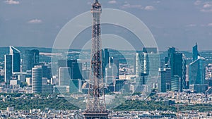 Aerial view from Montparnasse tower with Eiffel tower and La Defense district on background timelapse in Paris, France.