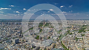 Aerial view from Montparnasse tower with Eiffel tower and La Defense district on background timelapse in Paris, France.