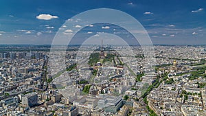 Aerial view from Montparnasse tower with Eiffel tower and La Defense district on background timelapse in Paris, France.