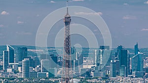 Aerial view from Montparnasse tower with Eiffel tower and La Defense district on background timelapse in Paris, France.