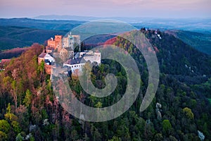 Aerial view on monumental Buchlov Castle, lit by setting sun. Czech republic.