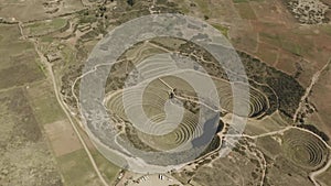 Aerial view of Moray Archeological site. Inca ruins of several terraced circular depressions, in Maras, Cusco province