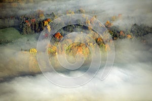 Aerial view of Morning fog and sunrise in autumn near Stowe, VT on Scenic Route 100