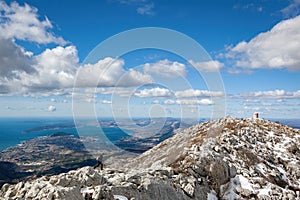 Aerial view of the Mosor Mountain near the shore of Sea in Dalmatia, Croatia under the blue sky