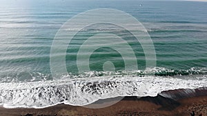Aerial view of the motion of the undertow in the winter sea