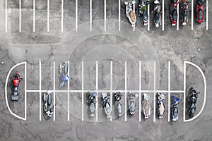 Aerial view of motorcycles parking row.