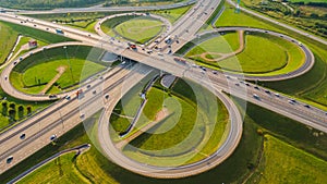 Aerial view of a motorway interchange with bridges and cars on a sunny day