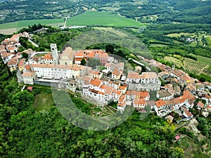 Aerial view of Motovun town on a hilltop with residential buildings in Croatia