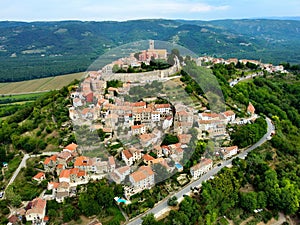 Aerial view of Motovun town on a hilltop with residential buildings in Croatia