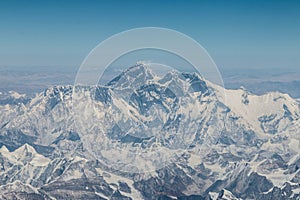 Aerial view of Mount Everest and surrounding mountains and snow covered landscape, on the flight from Tibet to Nepal.