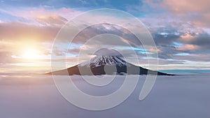 Aerial view of Mount Fuji with beautiful clouds over a clear sky and morning mist at sunrise. Japan\'s Mount Fuji