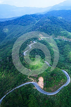 Aerial view of mountain asphalt road and dirt road