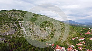 Aerial view of mountain and the city in the foots of the mountain