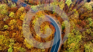 Aerial view of mountain curved road with no traffic. Asphalt serpentine roads details