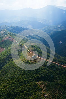 Aerial view of mountain dirt road and rice terraces