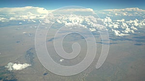 Aerial view of mountain landscape, view from window seat in an airplane