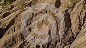 Aerial view on mountain range in arid area at sunny weather, top view