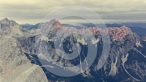 Aerial view of mountain ridge at dawn.