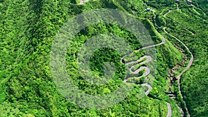 Aerial view mountain road at Jinguashi, Taiwan. Car driving through the curve.