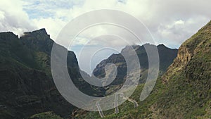 Aerial view of mountain road and town in Masca valley. Beautiful canyon in Tenerife, Canary Islands, Spain