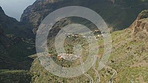 Aerial view of mountain road and town in Masca valley. Beautiful canyon in Tenerife, Canary Islands, Spain