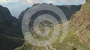 Aerial view of mountain road and town in Masca valley. Beautiful canyon in Tenerife, Canary Islands, Spain