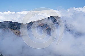 Aerial view of mountains emerging from the clouds, Pico do Arieiro, Madeira Portugal