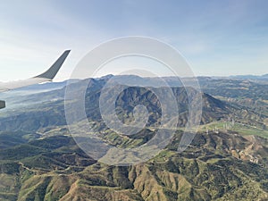 Aerial view of mountains and wind power propellers