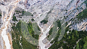 Aerial view of the mudflow with snow high in the Alpine mountains