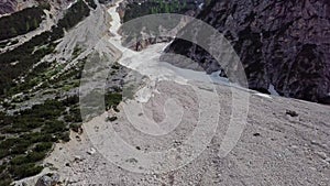 Aerial view of the mudflow with snow high in the Alpine mountains