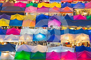 Aerial view of multiple colour of flea market roof top