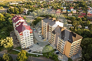 Aerial view of multistory apartment buildings in green residential area