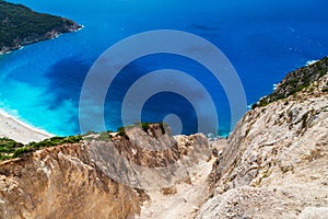 Aerial view at Myrtos Beach from bluff edge. Turquoise and blue Ionian Sea water. Greek islands. Top view, summer