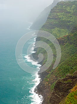 Aerial view of Na Pali coast with mist, Kauai Hawaii
